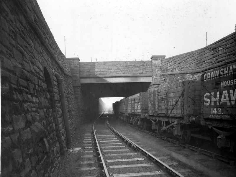 View looking from railway track with goods siding on to railway bridge overhead which is Wellington Road. Pictured in November 1938.