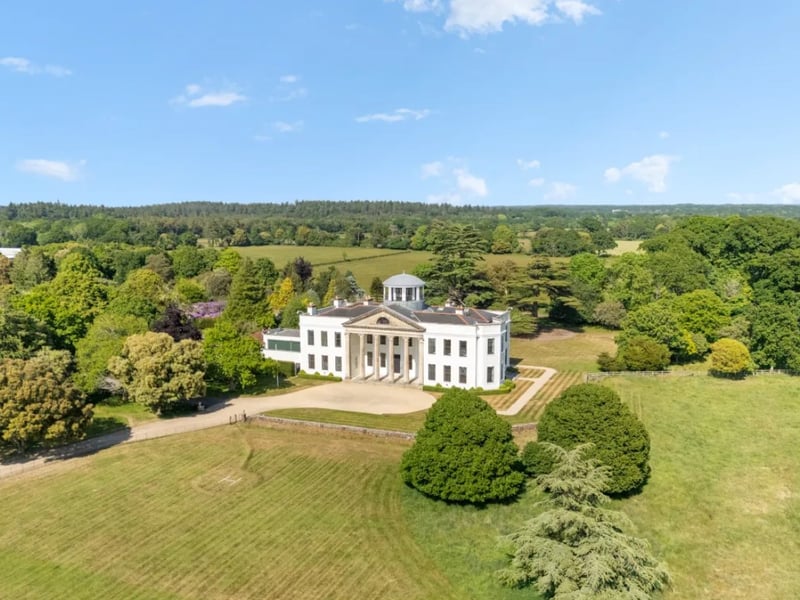 This 11 bedroom home comes with 12 bathrooms, six reception spaces, an orangery and three further dwellings.