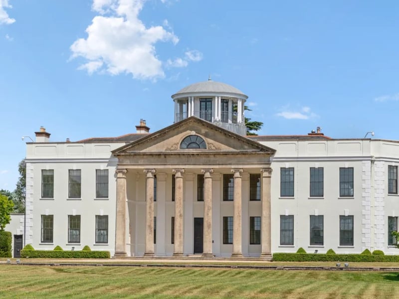 The listing says: "The house has been carefully preserved, a classical structure of perfect symmetry and proportion, with stuccoed elevations and sash windows."