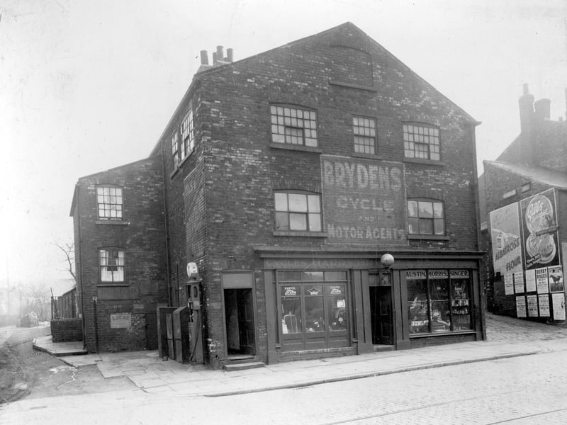 Two shops with living quarters on Whitehall Road. No.385 on the left is a newsagents, H.Kirby, no.387 is a fish and chip shop 'Sunshine Fisheries' business of George Brown. The advertising board on the pavement carries a poster for 'Film Fun'comic with a free George Formby songbook. Pictured in November 1938.
