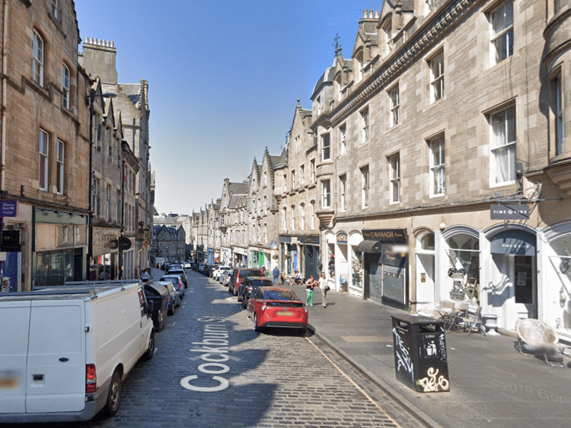 Merritt is seen walking down the picturesque Cockburn Street, in the Old Town, after appearing in court.