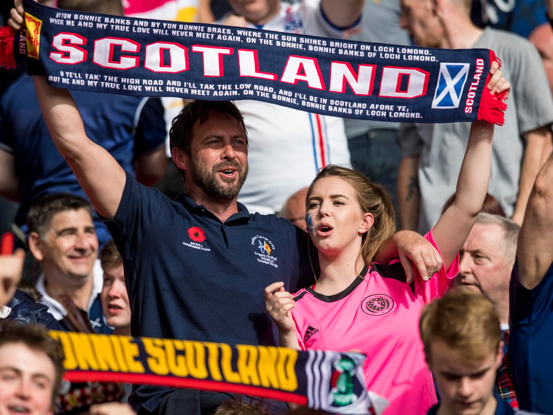 Fans sing the national anthem ahead of kick-off at Hampden.