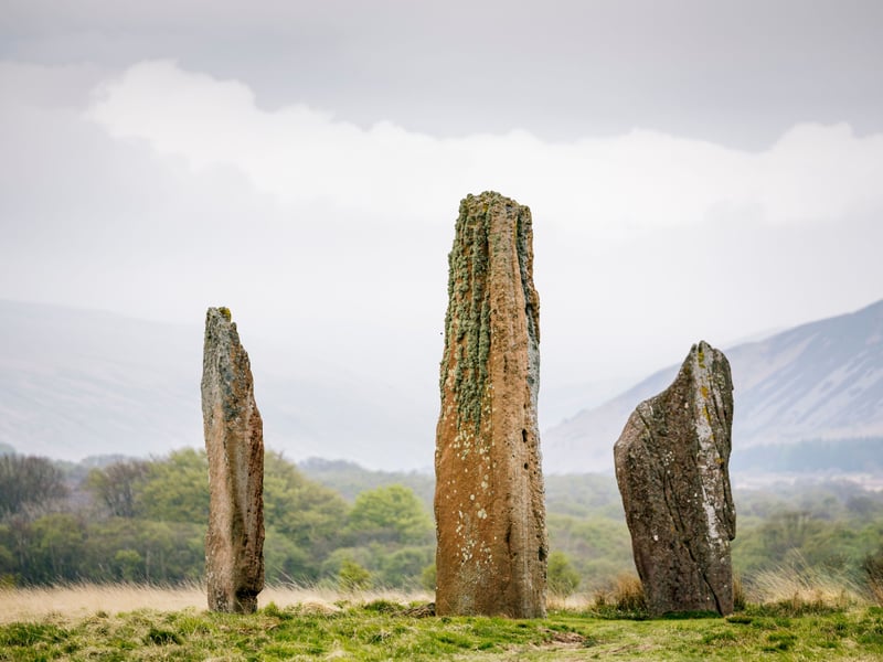 Recently named as an official UNESCO Global Geopark, the Isle of Arran boasts one of the most remarkable ancient landscapes in Britain. Situated on the west coast of the Isle, Machrie Moor is home to six stone circles, each with its own formation, age and story. The tallest stones, some rising over four metres, create a striking silhouette against the open sky. Reached via a one-mile path across moorland, this wild and windswept setting offers an atmospheric Solstice experience. As the sun dips or rises over the hills, the scale and symmetry of these ancient stones take on an otherworldly glow.