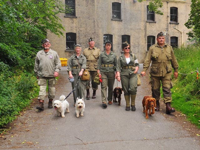 Re-enactors take time out for the doggies.