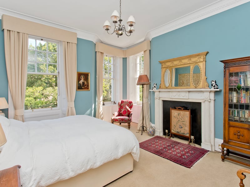 The property's second bedroom has a lovely feature fireplace surround, whilst also benefiting from direct access to the family bathroom.