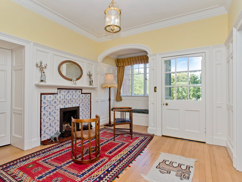 The front door opens into an entrance vestibule, flowing through to a reception hall, with a cloakroom, giving the first glimpse of the period-filled accommodation to follow with a lovely fireplace with Delft tiles. From here, you access additional internal halls, both also with storage.