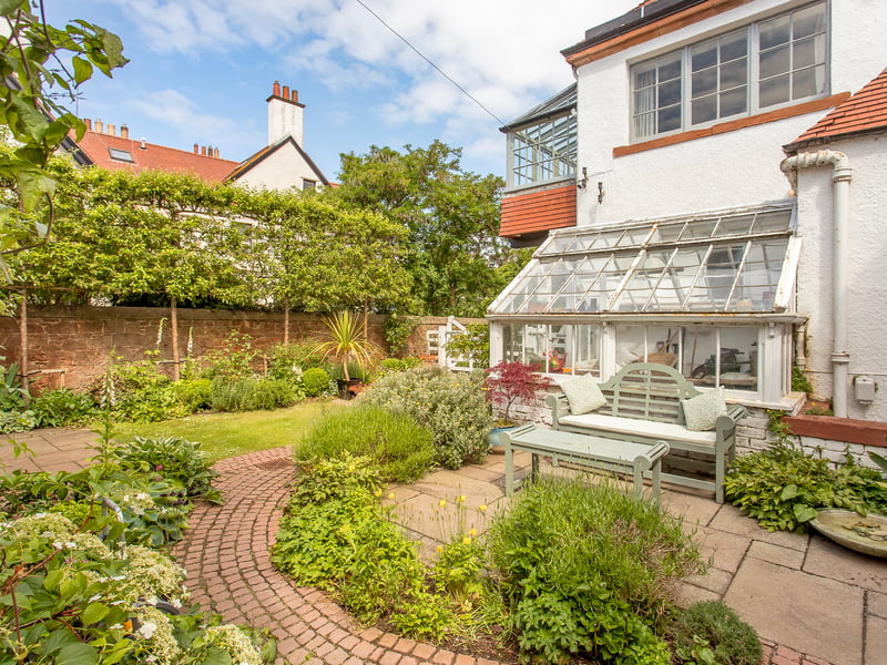 The villa boasts generous, delightful private gardens to the front, side, and rear, with the rear courtyard enjoying a wonderfully sunny aspect and featuring paved areas for outdoor dining furniture, a neatly kept lawn, a wealth of leafy shrubbery, and an original Victorian greenhouse which is attached to the property. There are also versatile stores, one of which is currently being utilised as a pottery studio.