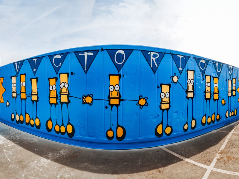 My Dog Sighs, a famous artist in Portsmouth, has teamed up with Victorious Festival to create a huge piece of artwork on a shipping container. 
