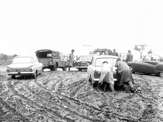 A view of the Royal Highland Show showing AA and RAC patrolmen assisting motorists bogged down in one of the car parks.
