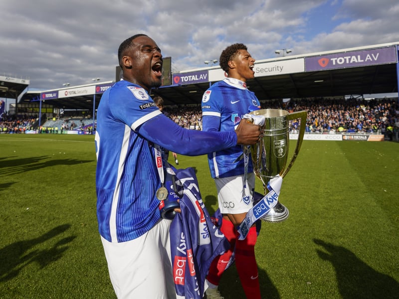 Christian Saydee celebrates with pal Kusini Yengi and the League One silverware in April of last year.