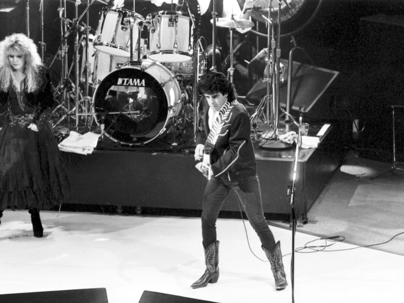 Singer Stevie Nicks with guitarist Billy Burnette on stage with Fleetwood Mac, in concert at the Playhouse theatre in Edinburgh, May 1988.