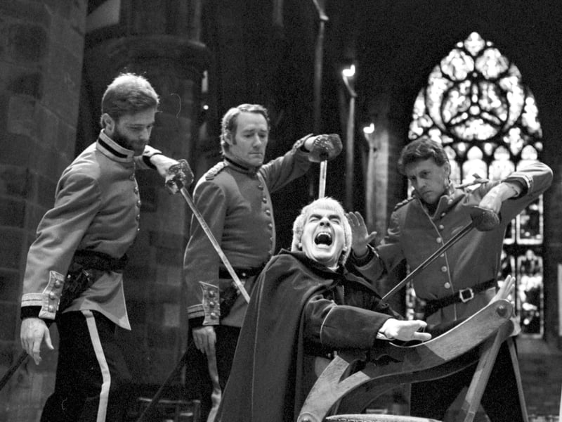 John Cairney as Archbishop Thomas a Beckett in the death scene of TS Eliot's Murder in the Cathedral, performed in St Giles cathedral during Edinburgh Festival 1986. The soldiers are played by Michael David, John Shedden and Steve Dalton.