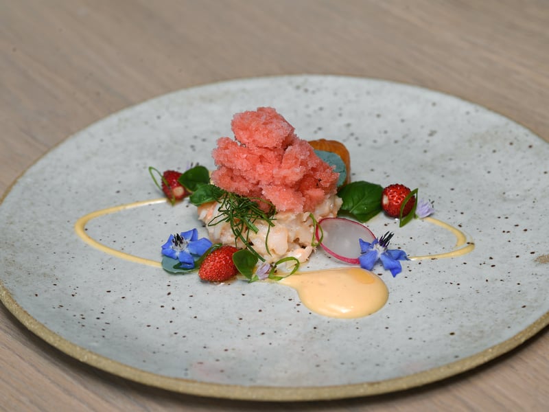 Harrogate’s FIFTY TWO has an open kitchen with tables that face the chefs as they cook. Michelin said of its tasting menu, “which is filled with assured, technically skilled dishes informed by their homegrown produce (from the 52 raised beds) and the preserved ingredients that line the shelves.”. The restaurant also allows guests to choose music to be played while dessert is served.