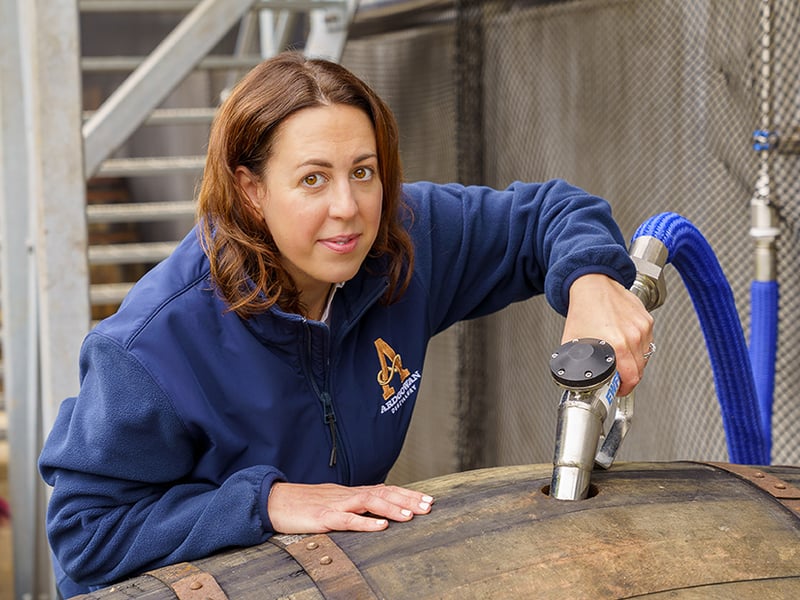 Distillery manager Laura Davies filling the first cask