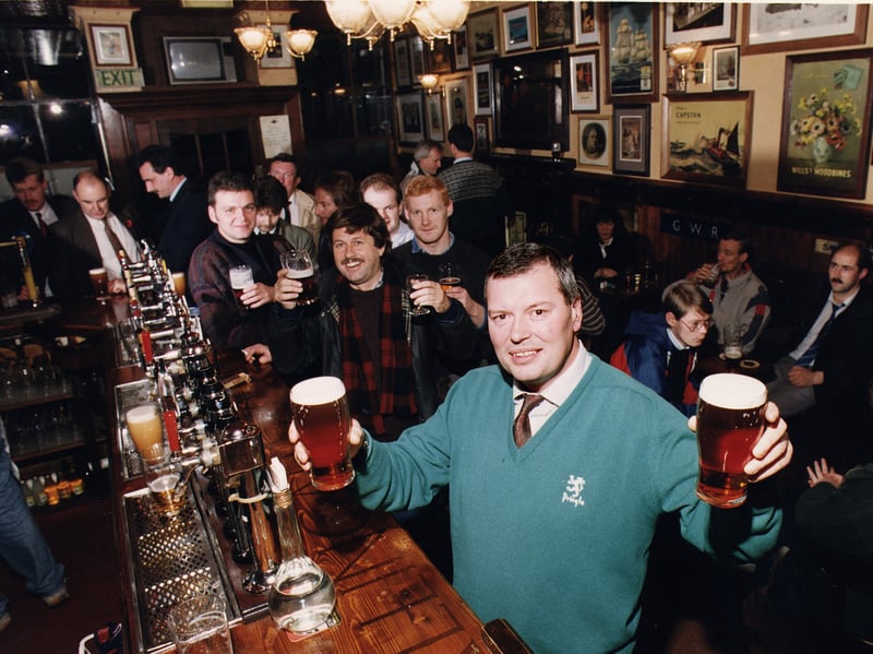 The Bow Bar manager Ian Whyte pictured with customers at the bar in 1990