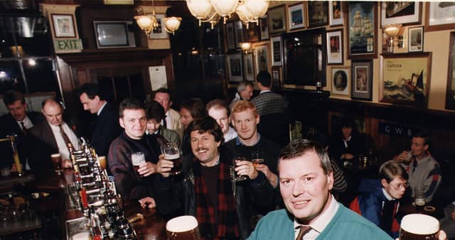 The Bow Bar manager Ian Whyte pictured with customers at the bar in 1990