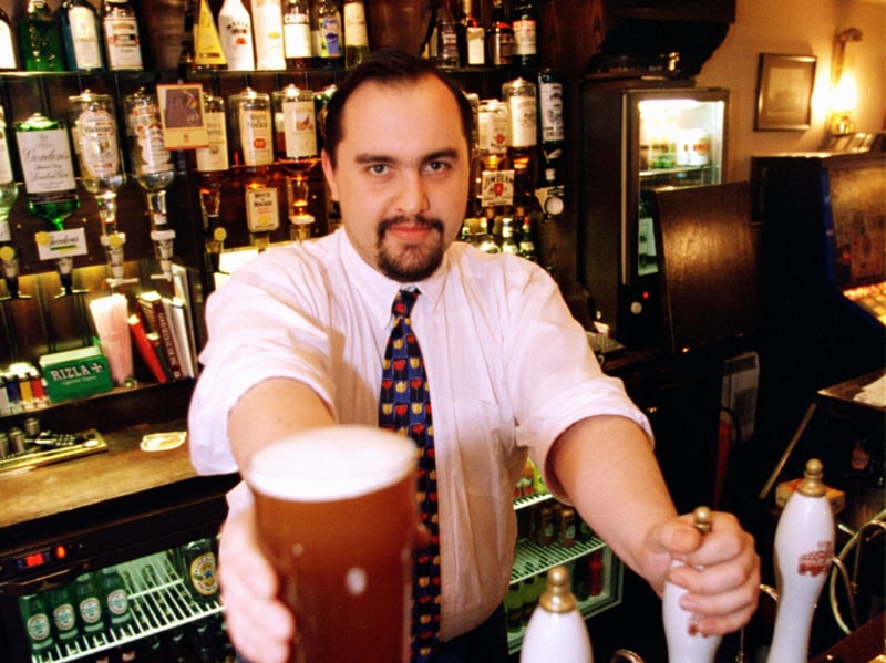 Brian Treadgold, manager of Carter's Bar, pictured serving a pint in 1997