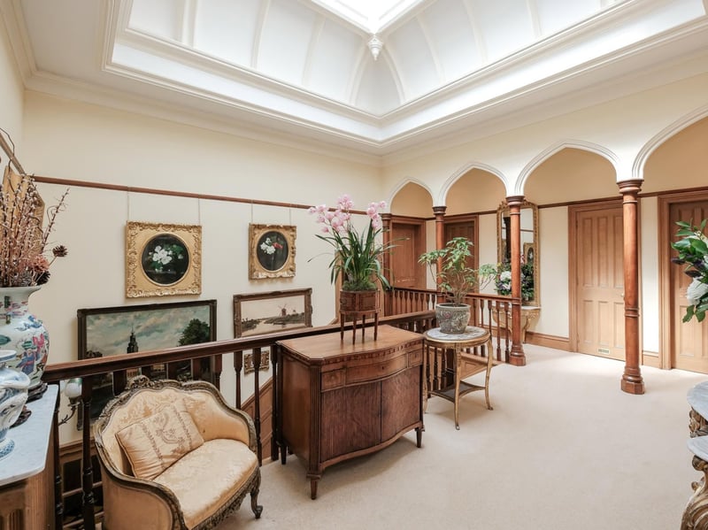 The bright and airy upper hallway has been done in a gothic revival style. 