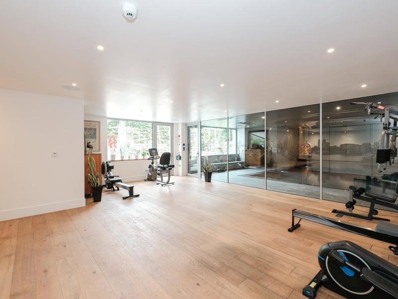 Just off the indoor pool is a home gym