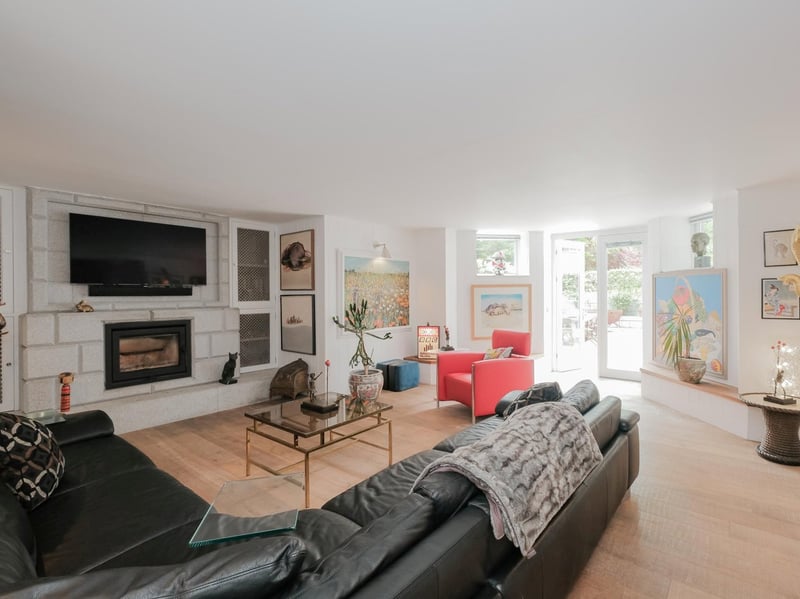 Located on the lower ground floor, the snug is a cosy living space with natural light.