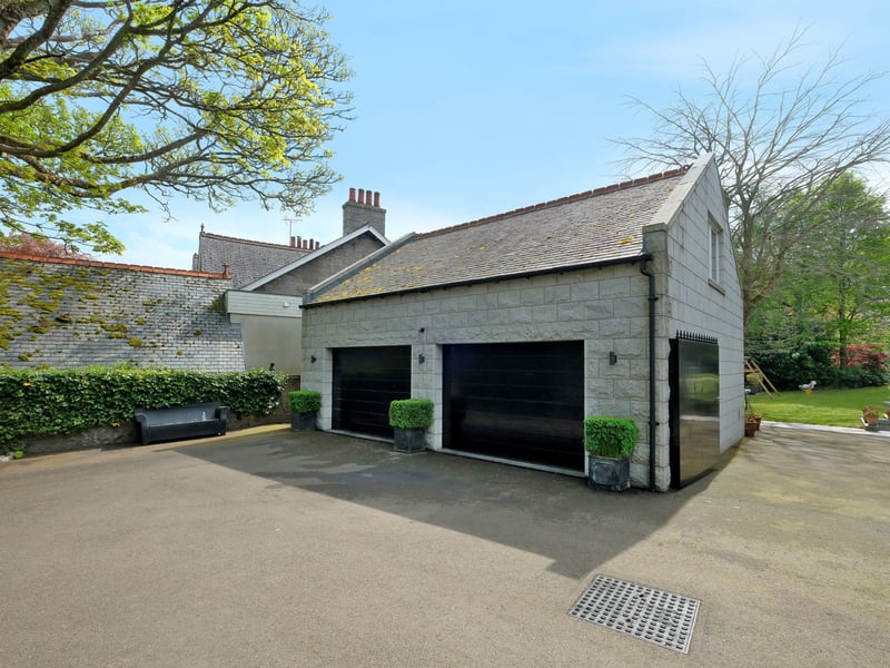 The coach house spans two floors, and features a double garage and WC on the ground floor, with the second level including a sitting room, kitchen, shower room and office.