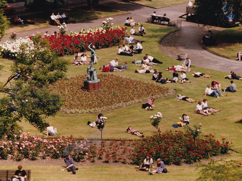 Office workers soak up the sun at Park Square in the summer of 1993.