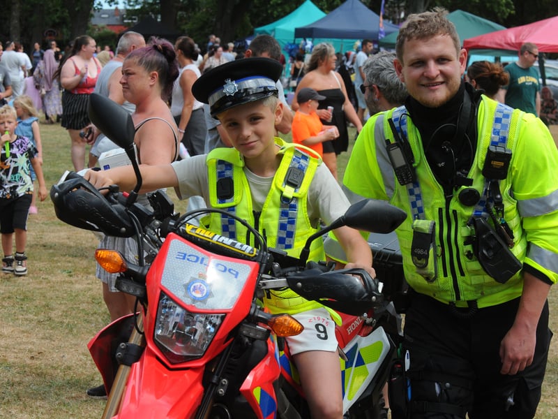 Nicholas Halilaj, 10, of Cottingley tries out the off-road bike with PC Ash Pritchard of Elland Road Police Station