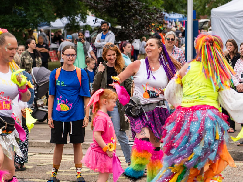 The Funkey Bug Dance Crew are dancing at the back of the street parade and people watch in joy.
Pictured by Alec Chapman
