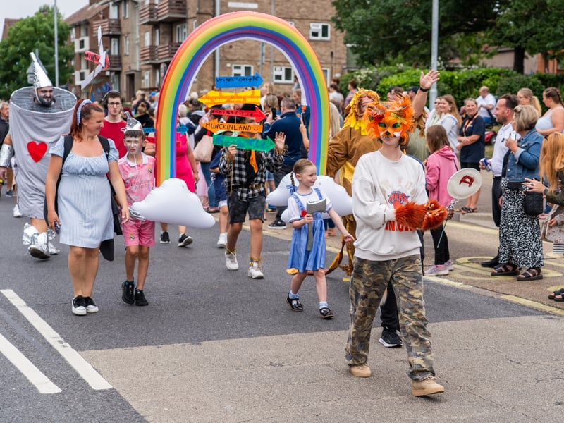 A group of adults and young people marching along the streets dressed up as the Wizard of Oz crew
Pictured by Alec Chapman