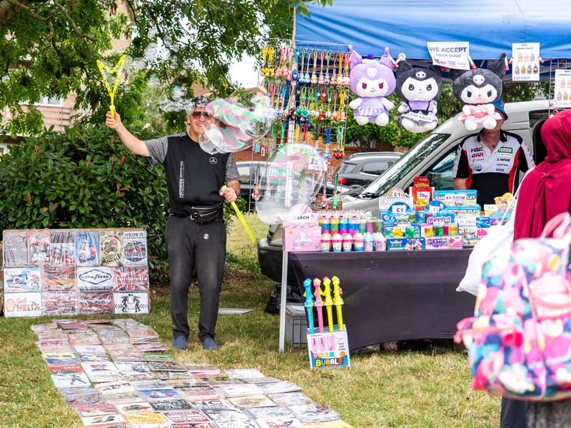 Graeme blows bubbles on his stool and sells posters and toys
Pictured by Alec Chapman