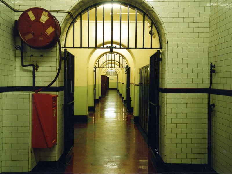 A view down the long corridor in Leeds Bridewell from the direction of the lift towards the Bridewell Office, or Custody Officer's Room. This corridor runs parrallel with Oxford Place and is located beneath the Town Hall. Cells are situated on either side.