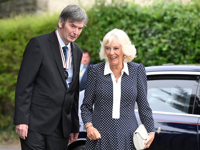Queen Camilla is greeted by Lord Lieutenant Sir Ian Rankin whilst arriving to officially open Ratho Library in Newbridge, Edinburgh, celebrating a partnership with Edinburgh International Book Festival and Edinburgh City Libraries as part of her trip to Scotland for Holyrood Week.