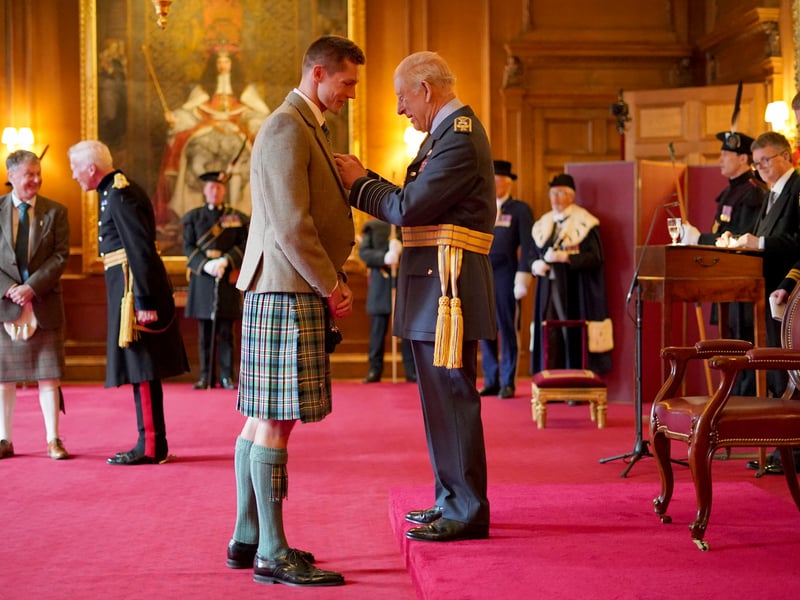 Duncan Scott, from Stirling, is made an Officer of the Order of the British Empire by King Charles III during an investiture ceremony at the Palace of Holyroodhouse, Edinburgh.