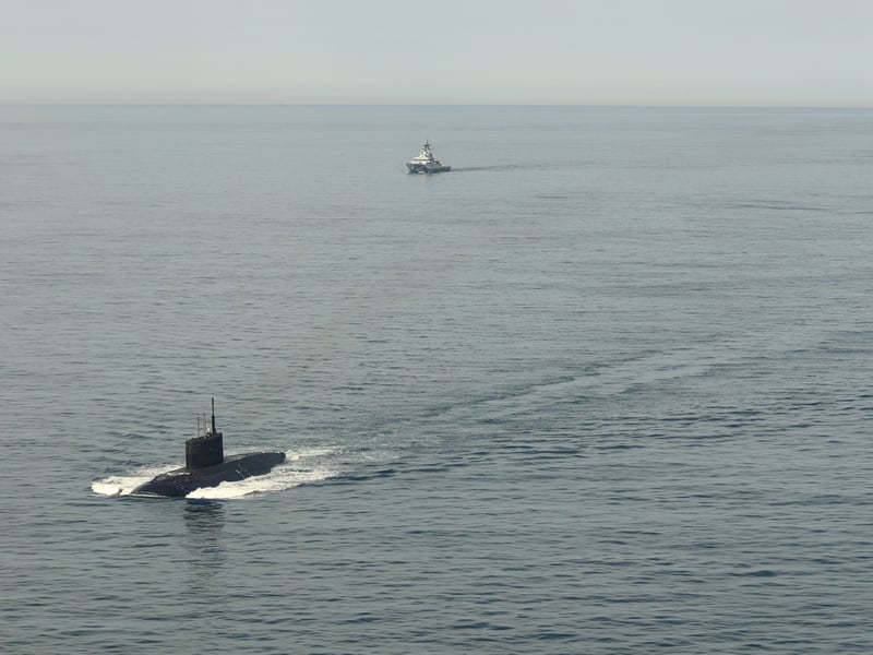 HMS Mersey and Royal Navy helicopters stalked the Russian submarine RFN Novorossiysk as it sailed through British waters.
