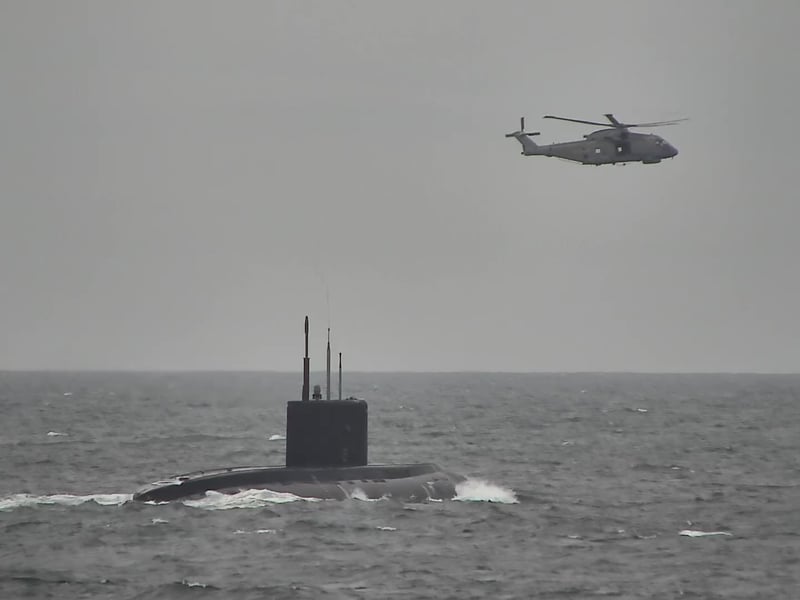 HMS Mersey and Royal Navy helicopters stalked the Russian submarine RFN Novorossiysk as it sailed through British waters.