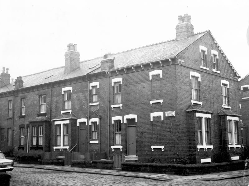 A row of four back-to-back terraced houses each with a small front garden. On the right the gable end faces onto Oldfield Avenue. Pictured in October 1972.