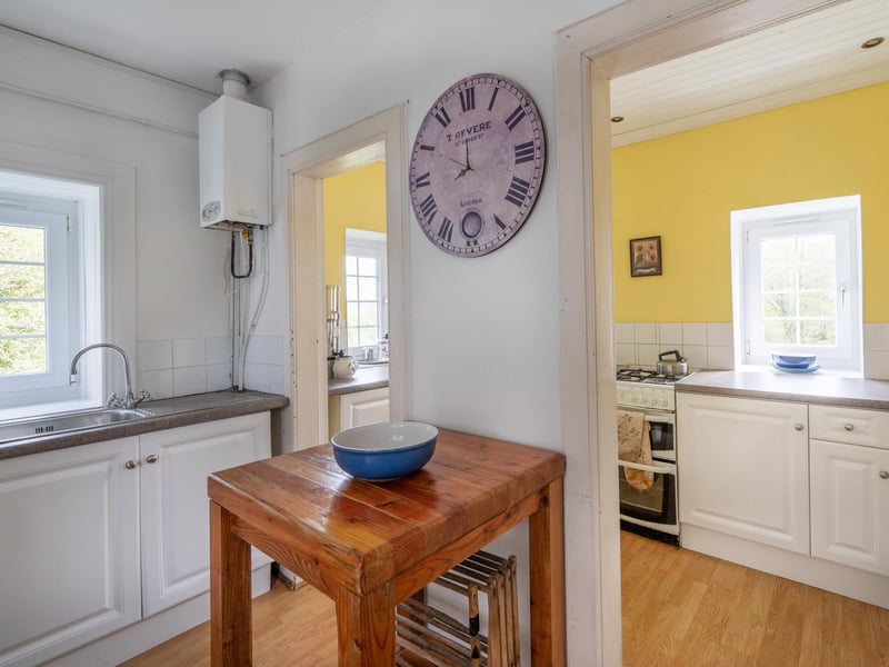 Meanwhile, the u-shaped kitchen backs on to a utility room.