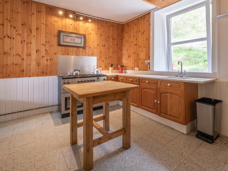 The large kitchen sits off a private dining room. 
