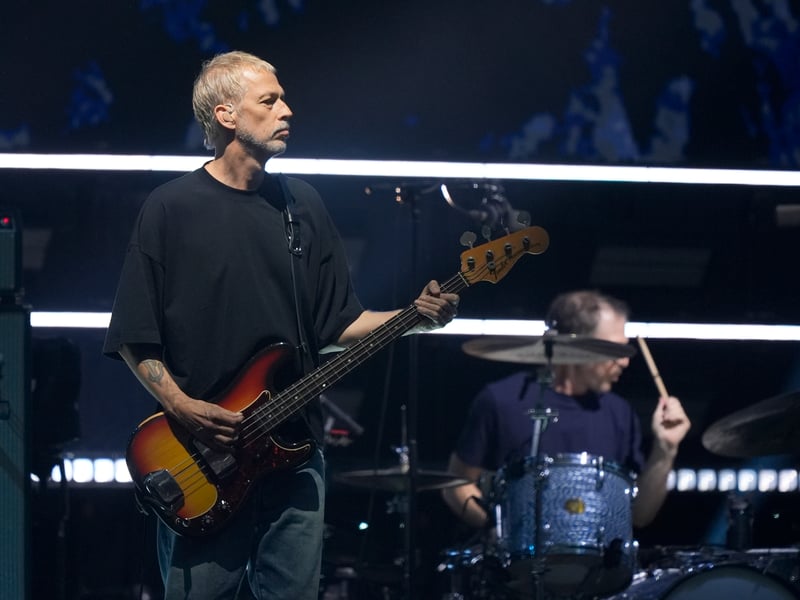 Andy Bell of Oasis on stage at the Principality Stadium, Cardiff, for the band's long-awaited reunion tour kicks off in Wales.