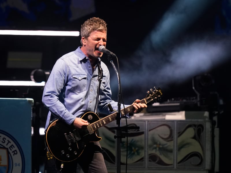 Noel Gallagher of Oasis on the stage at the Principality Stadium, Cardiff, for the band's long-awaited reunion tour kicks off in Wales.