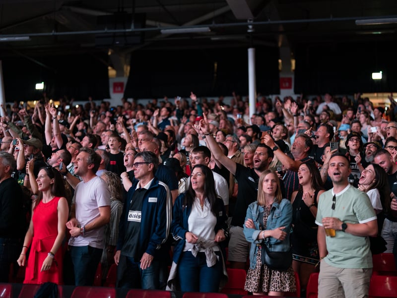 The crowd waits for Oasis to take to the stage at the Principality Stadium, Cardiff, as the band's long-awaited reunion tour kicks off in Wales.