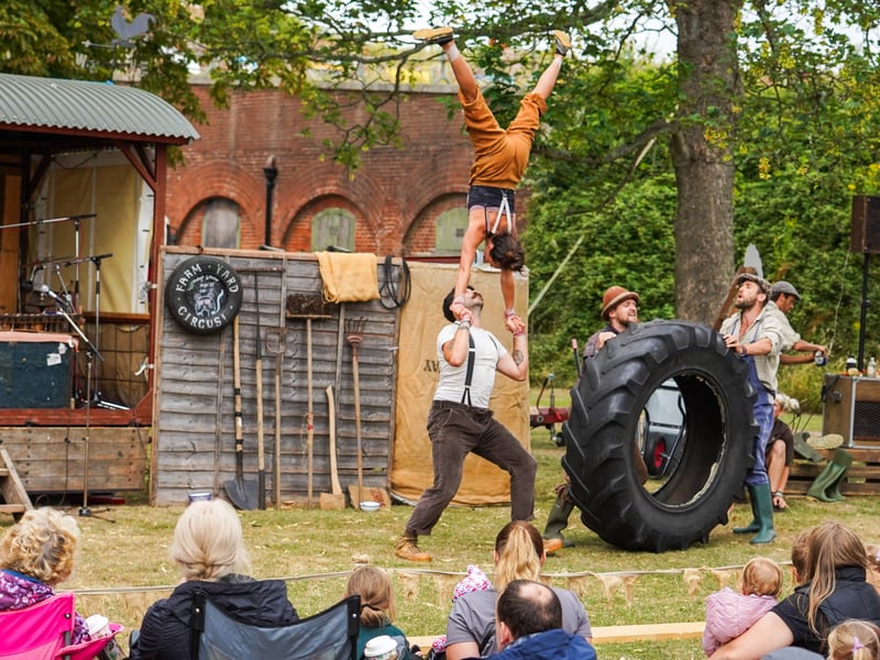 Kirstie being held upside down at the Festival at Fort Brockhurst in Gosport. Pictured is Ben Walker, Kirstie Eggington, Harry Clements and Jack Clements. Pictured by Alec Chapman