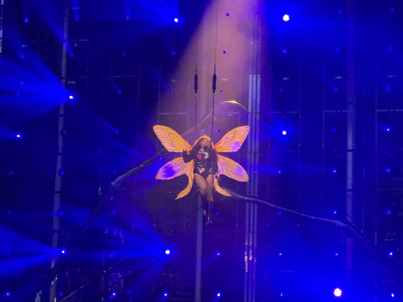 SZA takes to the skies after transforming into a butterfly.