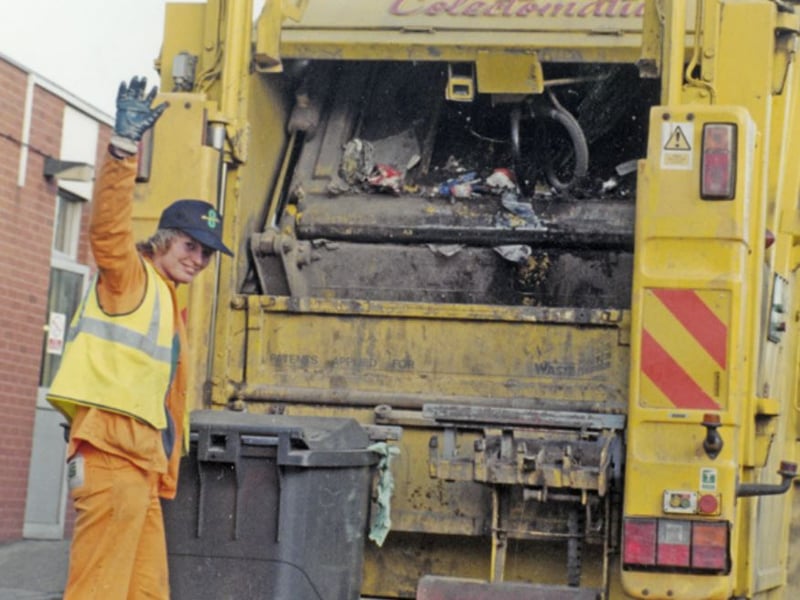 A refuse collector at work in Sheffield in December 1996