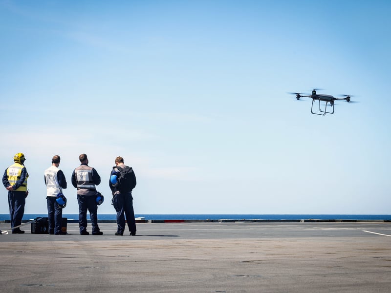 Pictured: 700X Naval Air Squadron Personnel using a Malloy Aeronautics Heavy Lift Drone during a test flight from the flight deck of HMS Prince of Wales.