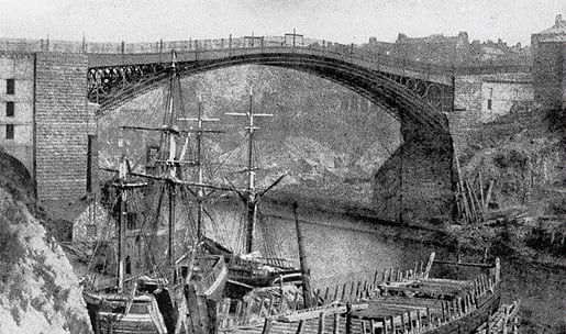 A view of the original Wearmouth Bridge. Its safety levels were tested by having soldiers walk backwards and forwards over it.
Thomas Paine was the person who designed the original Wearmouth Bridge, which was once the longest single-span cast iron bridge in the world; and helped catalyse growth.