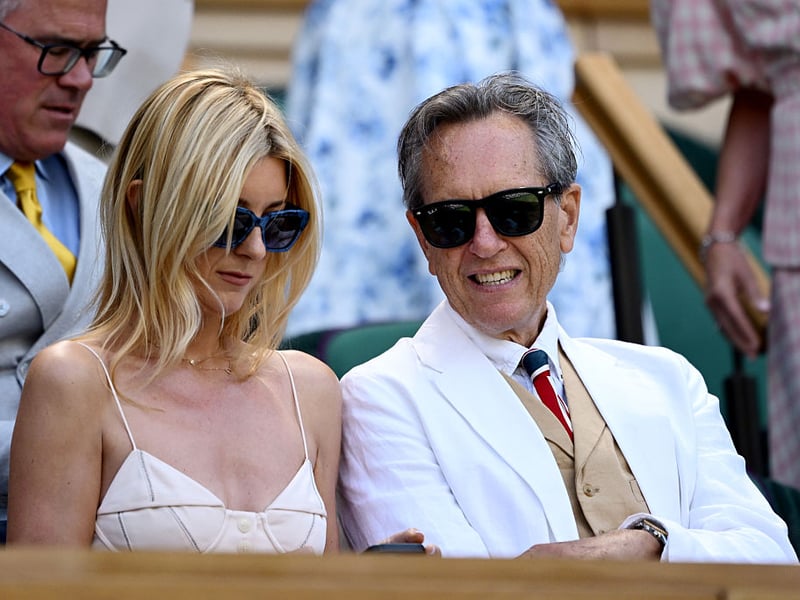 How dapper does actor Richard E. Grant look in a white suit, waistcoat and tie? His daughter Olivia Grant also looks chic in a summer dress with straps