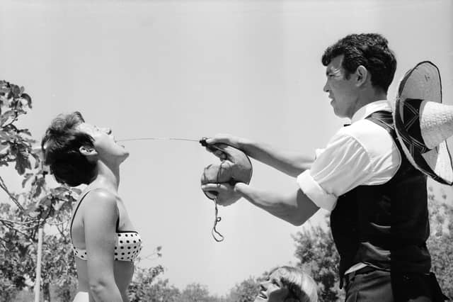 The 60s was when foreign travel first became affordable for many people in the UK, with cheap flights and package holidays sparking a summer exodus to resorts in Spain, Italy and elsewhere across Europe. We soaked up the sun, absorbed the culture and sampled the cuisine - all without the guilt of knowing the harm those air miles were wreaking on the planet. Pictured here is a holidaymaker learning how to drink wine 'the traditional Spanish way' in Majorca in 1967.
