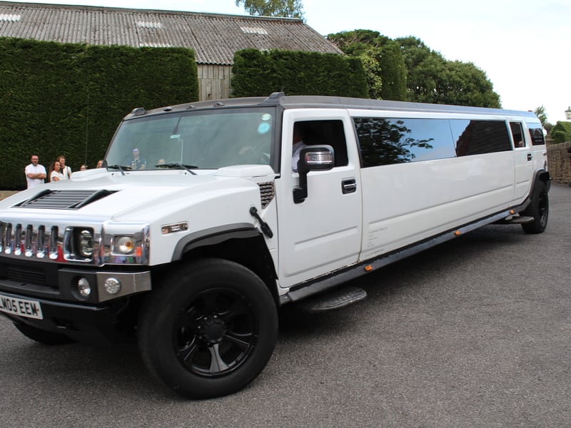A limousine pulls up