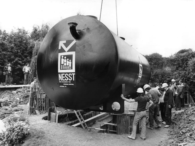 A British-built Nuclear Emergency Survival System (NESST) being installed. It was intended to enable up to 12 occupants could live comfortably on a normal diet for up to four weeks with protection from the initial nuclear explosion and subsequent radioactive fallout, as well as from biological and chemical weapons. Designed by the Swiss engineer Dr Werner Heierli, and manufactured for Personal Survival Systems, it cost £10,000.